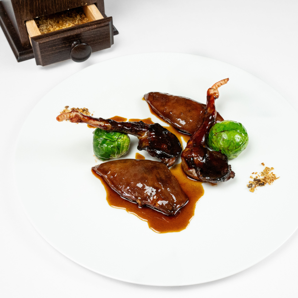 Whole-roasted grilled pigeon, confit 'ptits choux', pigeon liver jus